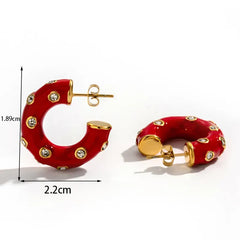 aretes statement rojos elegantes con detalles dorados mujer
