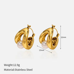 aretes dorados con perla mostrando medidas y detalle moderno