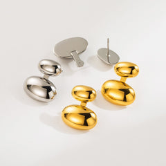 aretes modernos en acero inoxidable con acabado pulido elegante