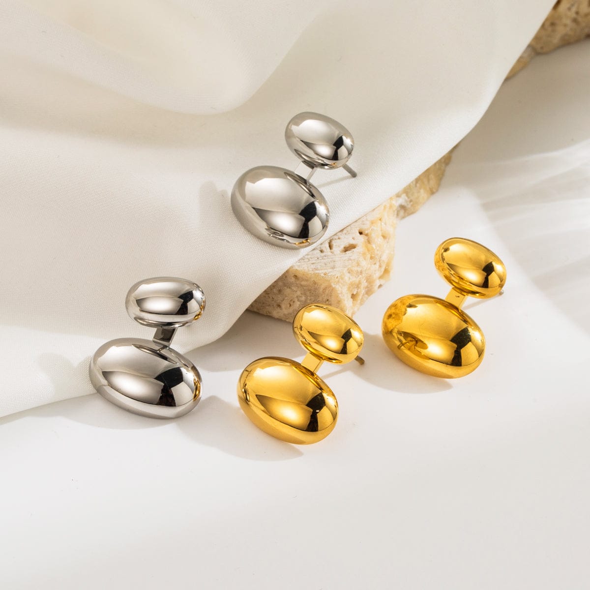 variantes de aretes elara en dorado y plateado estilo moderno