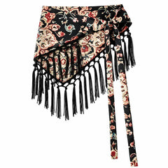 Cinturón pañoleta Bohemia Chic con estampado flora fondo negro, amarre lateral y flecos negros sobre fondo blanco.