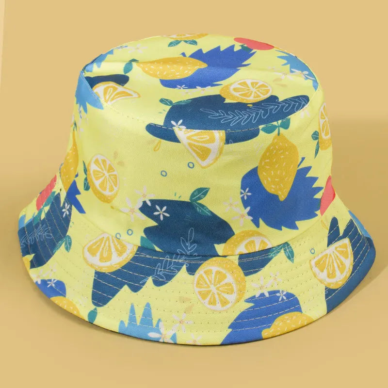 Sombrero Bucket Doble Vista reversible con estampado de limones amarillos y reverso color negro.