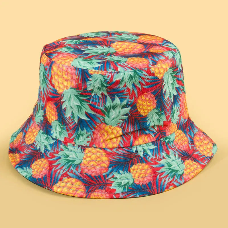 Sombrero Bucket Doble Vista reversible con estampado de piñas y reverso color negro.